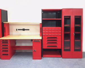 red workcetner with built-in cabinets